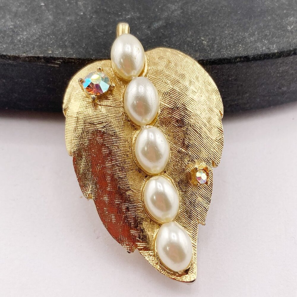 CORO Vintage brushed gold tone metal, faux pearl, and AB rhinestone leaf brooch
